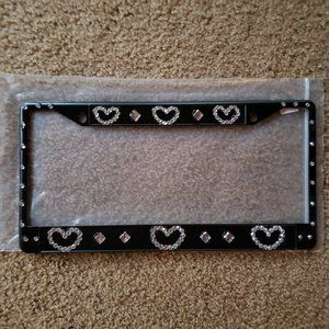 Metal license plate holder with crystals